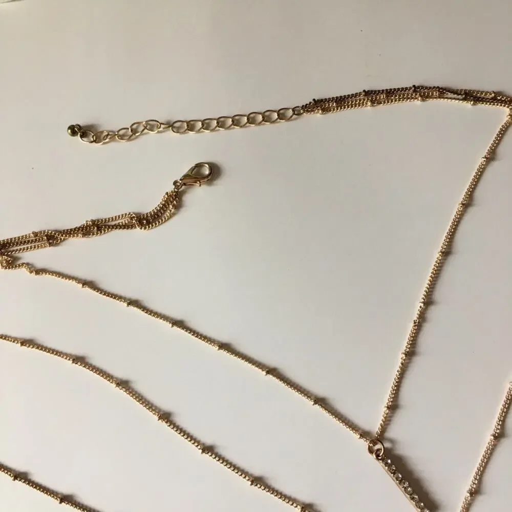 Boho gold tone three strand layered necklace